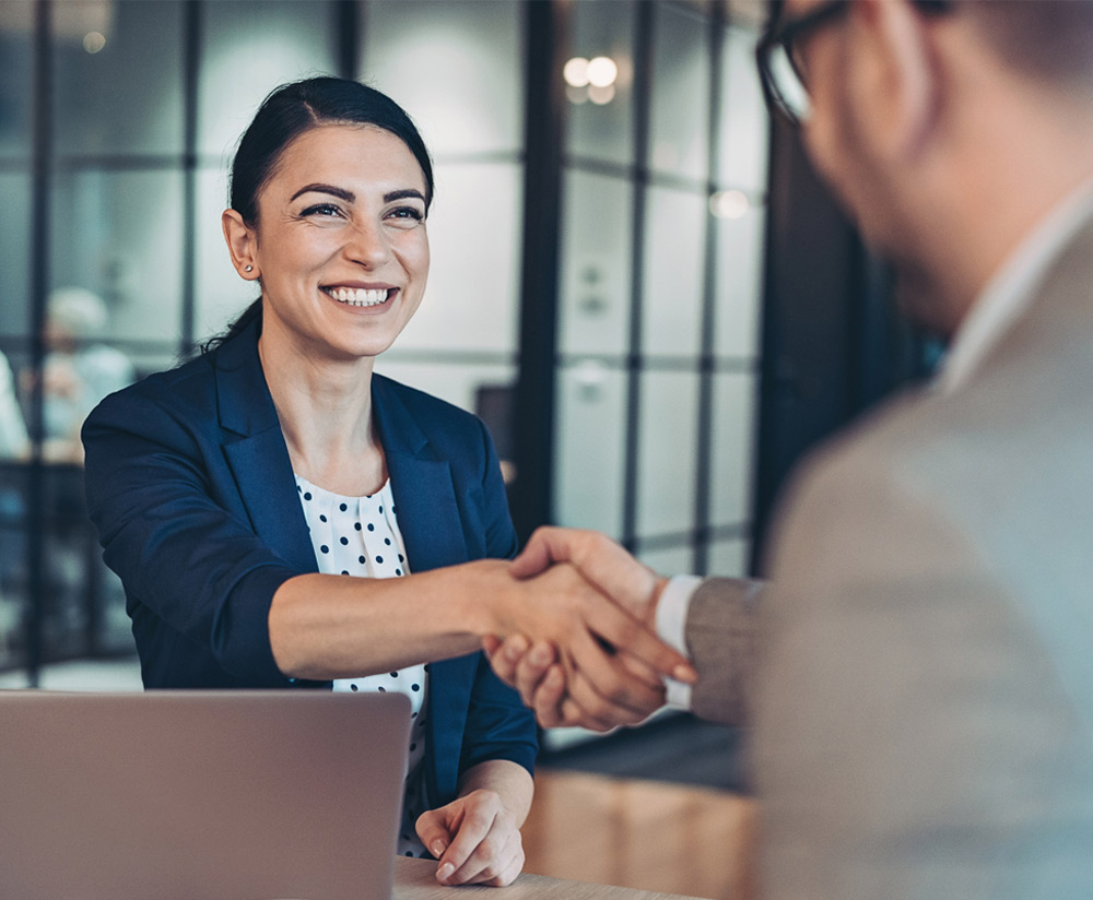 a man and a woman looking at the camera